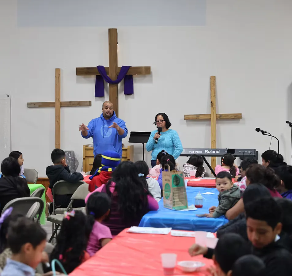 A gathering at CNMC with two wooden crosses at the front
